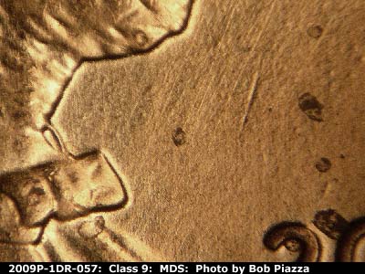 Die-stage B marker on 2009P•1DR•057 (2009 Doubled Die Reverse).