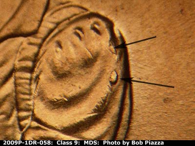 Die-stage B marker on 2009P•1DR•058 (2009 Doubled Die Reverse).