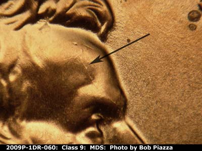 Die-stage B marker on 2009P•1DR•060 (2009 Doubled Die Reverse).