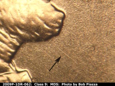 Die-stage B marker on 2009P•1DR•062 (2009 Doubled Die Reverse).