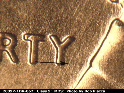 Die-stage B marker on 2009P•1DR•062 (2009 Doubled Die Reverse).