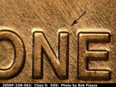 Die-stage A marker on 2009P•1DR•063 (2009 Doubled Die Reverse).