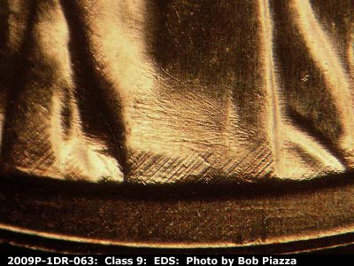 Die-stage A marker on 2009P•1DR•063 (2009 Doubled Die Reverse).