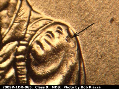 Die-stage B marker on 2009P•1DR•065 (2009 Doubled Die Reverse).