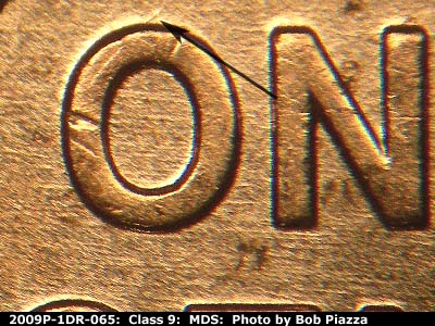 Die-stage B marker on 2009P•1DR•065 (2009 Doubled Die Reverse).