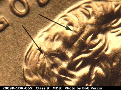Die-stage B marker on 2009P•1DR•065 (2009 Doubled Die Reverse).