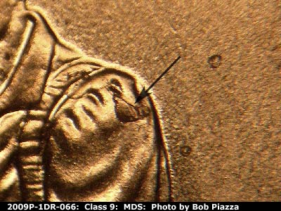 Die-stage B marker on 2009P•1DR•066 (2009 Doubled Die Reverse).