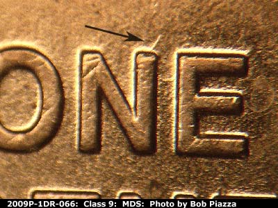 Die-stage B marker on 2009P•1DR•066 (2009 Doubled Die Reverse).