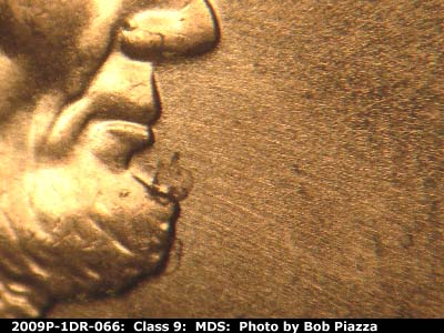 Die-stage B marker on 2009P•1DR•066 (2009 Doubled Die Reverse).