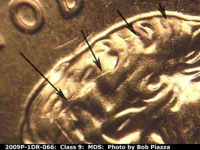 Die-stage B marker on 2009P•1DR•066 (2009 Doubled Die Reverse).