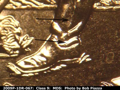 Die-stage B marker on 2009P•1DR•067 (2009 Doubled Die Reverse).