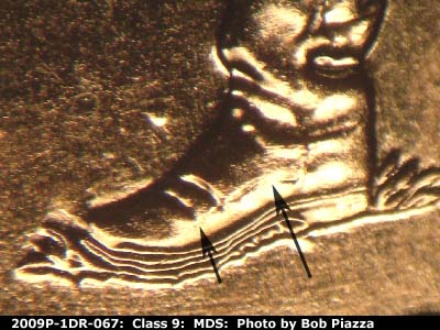 Die-stage B marker on 2009P•1DR•067 (2009 Doubled Die Reverse).