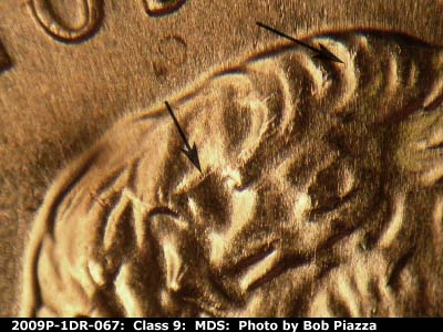 Die-stage B marker on 2009P•1DR•067 (2009 Doubled Die Reverse).