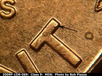 Die-stage B marker on 2009P•1DR•069 (2009 Doubled Die Reverse).