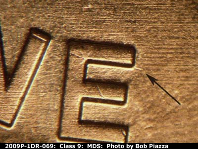 Die-stage B marker on 2009P•1DR•069 (2009 Doubled Die Reverse).