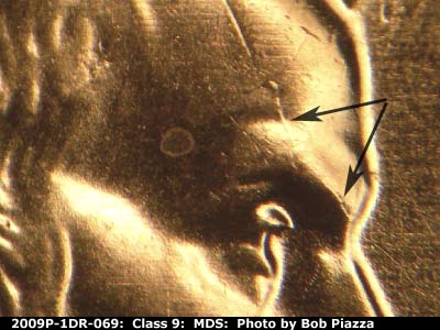Die-stage B marker on 2009P•1DR•069 (2009 Doubled Die Reverse).