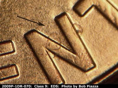 Die-stage A marker on 2009P•1DR•070 (2009 Doubled Die Reverse).