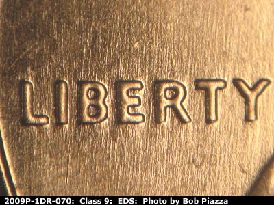 Die-stage A marker on 2009P•1DR•070 (2009 Doubled Die Reverse).