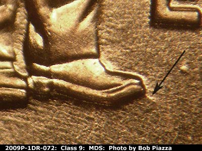 Die-stage B marker on 2009P•1DR•072 (2009 Doubled Die Reverse).