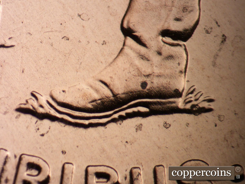 Die-stage A marker on 2009P•1DR•073 (2009 Doubled Die Reverse).