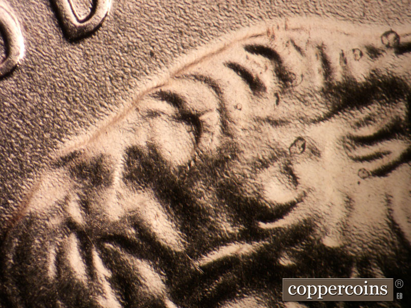 Die-stage A marker on 2009P•1DR•073 (2009 Doubled Die Reverse).