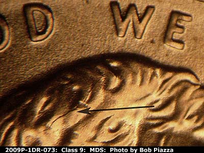 Die-stage B marker on 2009P•1DR•073 (2009 Doubled Die Reverse).