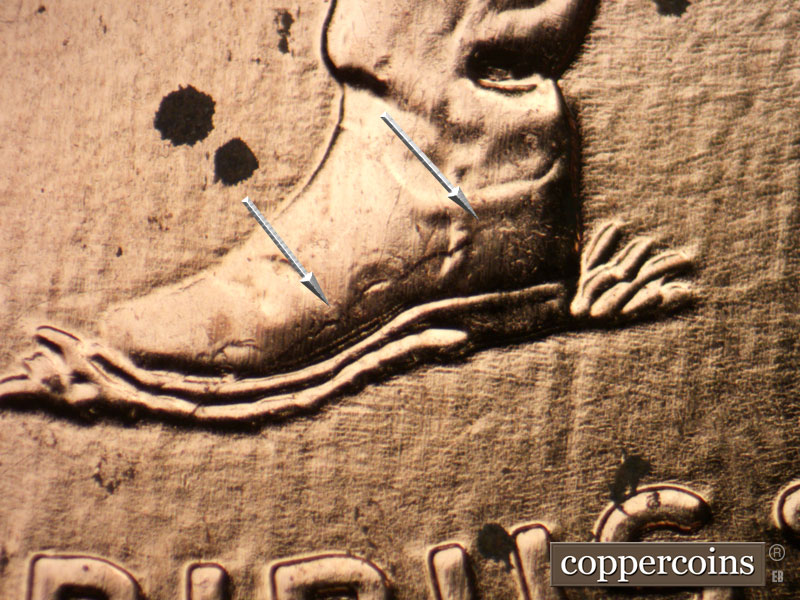 Die-stage B marker on 2009P•1DR•074 (2009 Doubled Die Reverse).