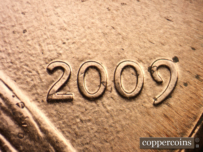 Die-stage B marker on 2009P•1DR•074 (2009 Doubled Die Reverse).