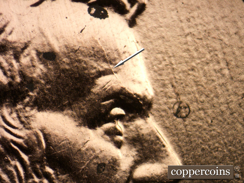 Die-stage B marker on 2009P•1DR•074 (2009 Doubled Die Reverse).
