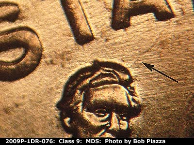 Die-stage B marker on 2009P•1DR•076 (2009 Doubled Die Reverse).