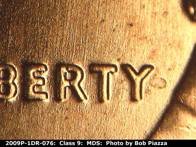 Die-stage B marker on 2009P•1DR•076 (2009 Doubled Die Reverse).