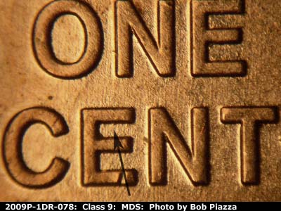 Die-stage B marker on 2009P•1DR•078 (2009 Doubled Die Reverse).