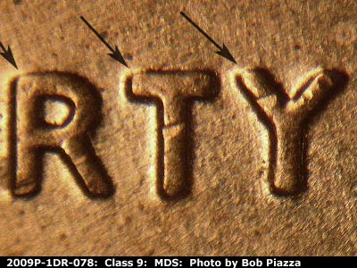 Die-stage B marker on 2009P•1DR•078 (2009 Doubled Die Reverse).