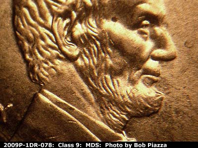 Die-stage B marker on 2009P•1DR•078 (2009 Doubled Die Reverse).