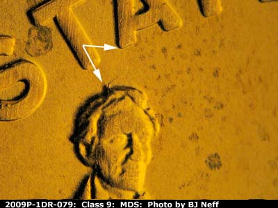 Die-stage B marker on 2009P•1DR•079 (2009 Doubled Die Reverse).
