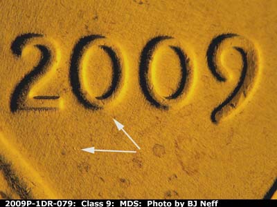 Die-stage B marker on 2009P•1DR•079 (2009 Doubled Die Reverse).