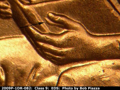 Die-stage A marker on 2009P•1DR•082 (2009 Doubled Die Reverse).