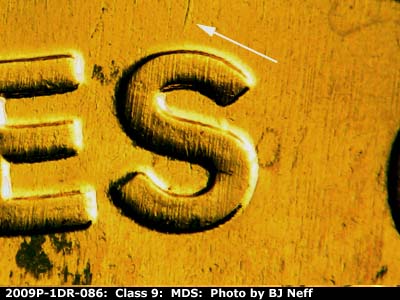 Die-stage B marker on 2009P•1DR•086 (2009 Doubled Die Reverse).