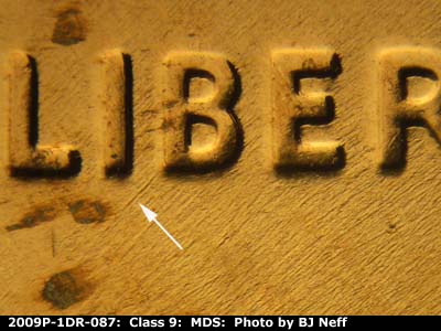 Die-stage B marker on 2009P•1DR•087 (2009 Doubled Die Reverse).