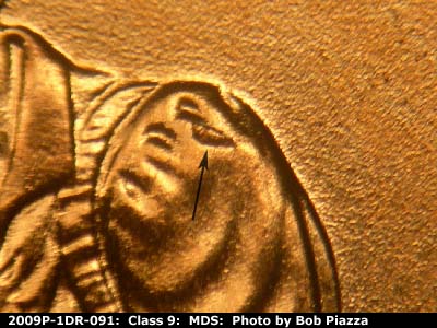 Die-stage B marker on 2009P•1DR•091 (2009 Doubled Die Reverse).