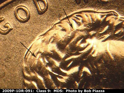 Die-stage B marker on 2009P•1DR•091 (2009 Doubled Die Reverse).