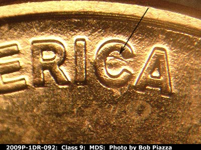 Die-stage B marker on 2009P•1DR•092 (2009 Doubled Die Reverse).