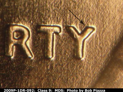Die-stage B marker on 2009P•1DR•092 (2009 Doubled Die Reverse).