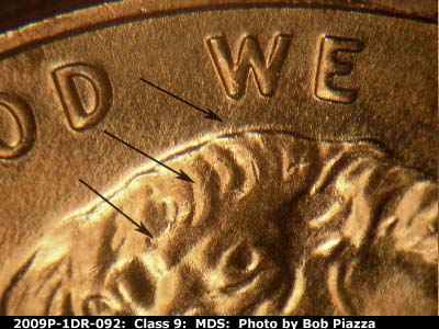 Die-stage B marker on 2009P•1DR•092 (2009 Doubled Die Reverse).