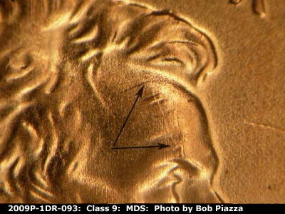Die-stage B marker on 2009P•1DR•093 (2009 Doubled Die Reverse).
