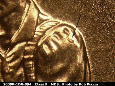 Die-stage B marker on 2009P•1DR•094 (2009 Doubled Die Reverse).