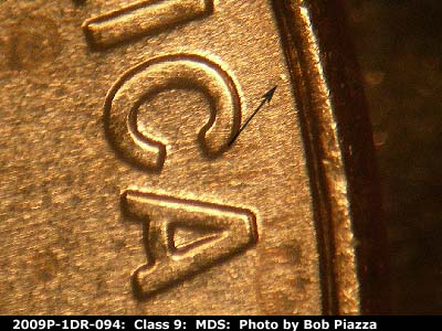 Die-stage B marker on 2009P•1DR•094 (2009 Doubled Die Reverse).