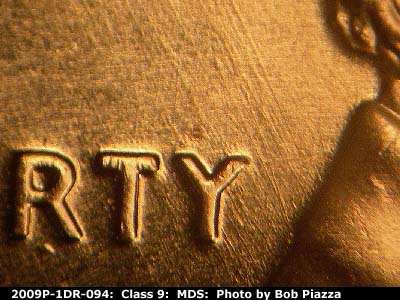 Die-stage B marker on 2009P•1DR•094 (2009 Doubled Die Reverse).