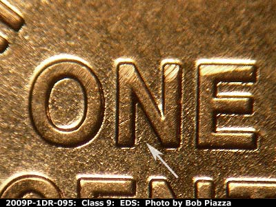 Die-stage A marker on 2009P•1DR•095 (2009 Doubled Die Reverse).