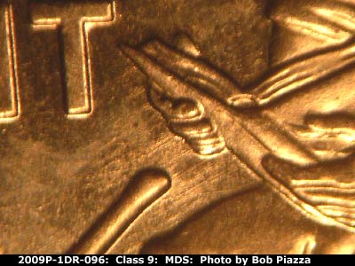 Die-stage B marker on 2009P•1DR•096 (2009 Doubled Die Reverse).